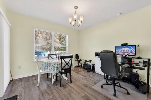 a view of a dining room with furniture window and wooden floor