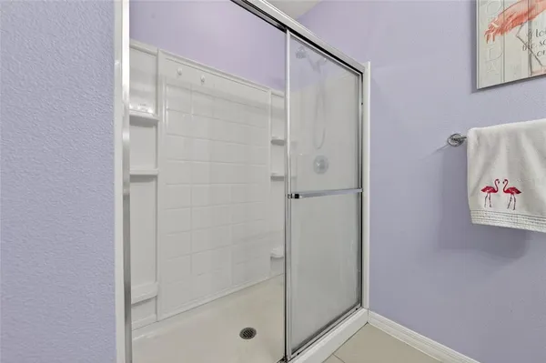 a bathroom with a shower and a sink