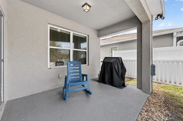 a view of a workspace with furniture and window
