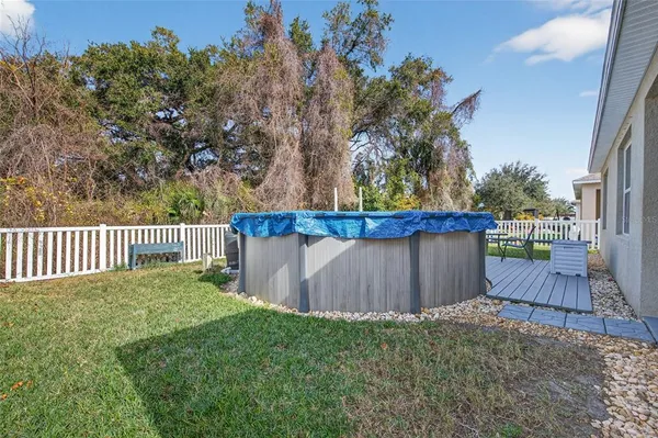 a view of a backyard with a fence