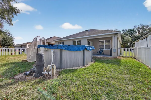 a view of backyard with a garden and plants