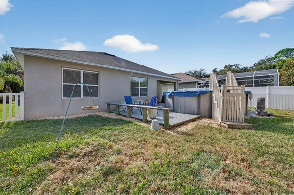 a view of a backyard with a barn and a table and chairs