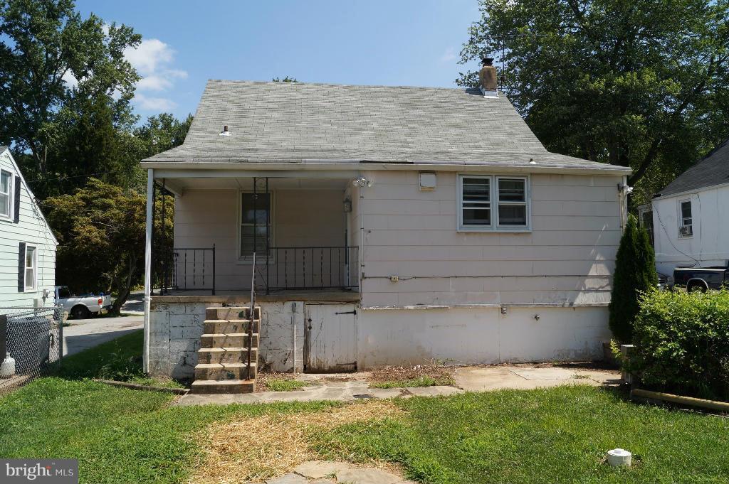 3113 Offutt Road Randallstown, MD 21133 - Photo 14 of 14 a front view of a house with a yard