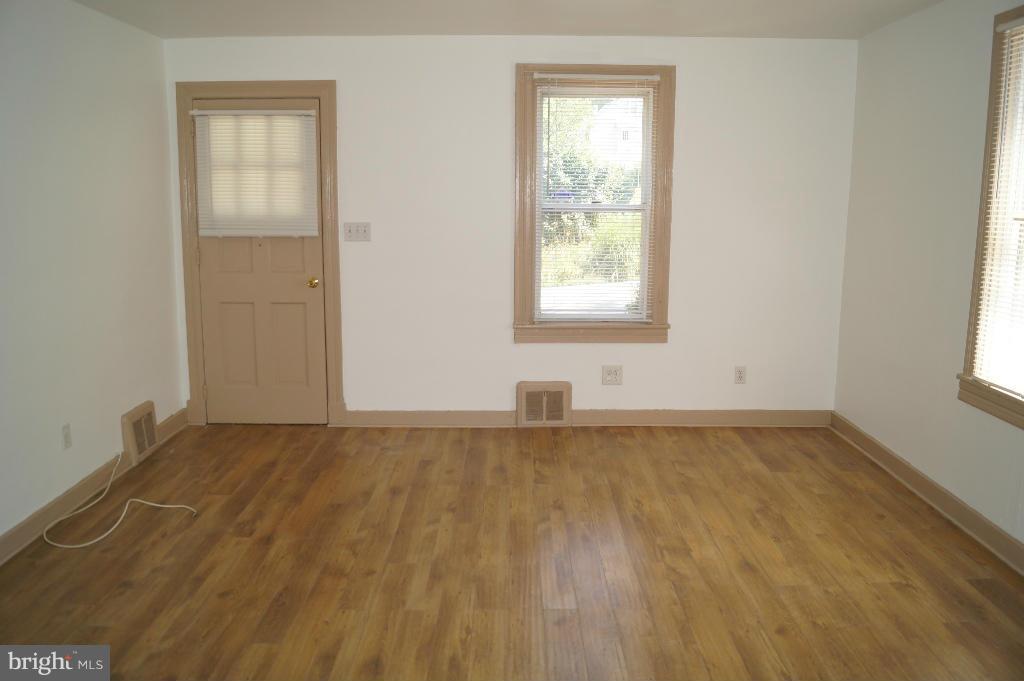 3113 Offutt Road Randallstown, MD 21133 - Photo 6 of 14 an empty room with a window