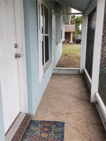 a view of room with window and hardwood floor