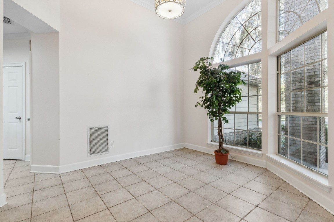 86305 Meadowfield Bluffs Road Yulee, FL 32097 - Photo 11 of 33 a view of empty room with window and wooden floor