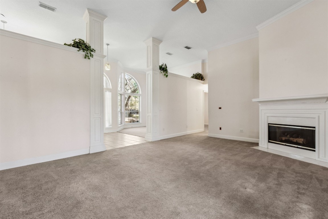 86305 Meadowfield Bluffs Road Yulee, FL 32097 - Photo 16 of 33 an empty room with windows and fireplace