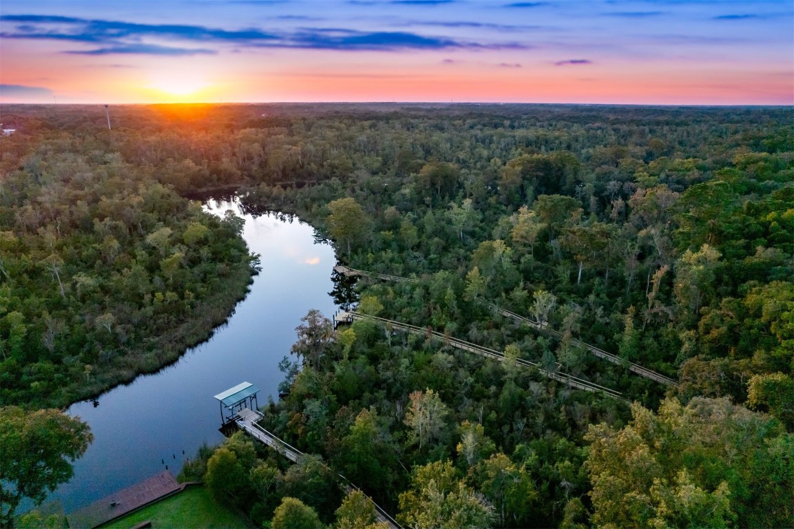 86305 Meadowfield Bluffs Road Yulee, FL 32097 - Photo 2 of 33 a view of a lake with mountains in the background