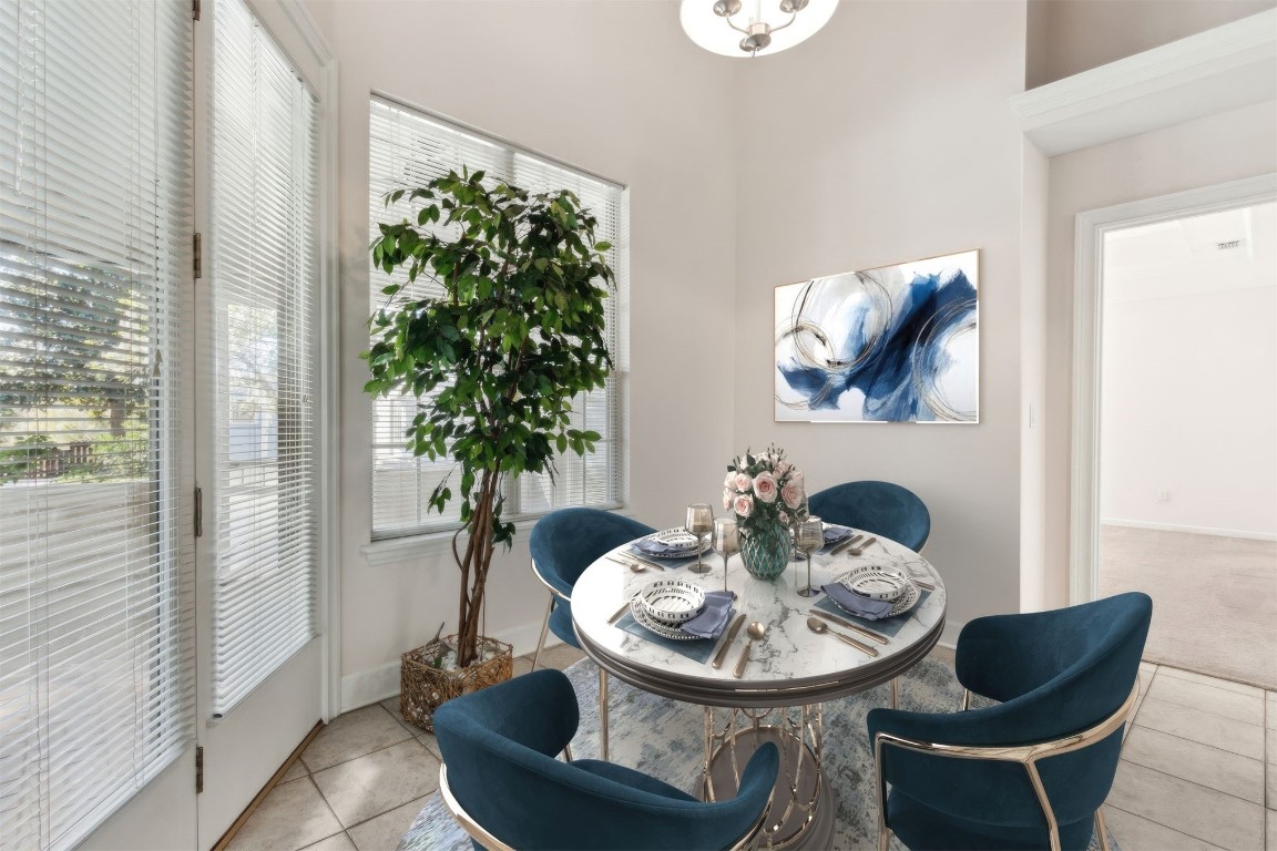 86305 Meadowfield Bluffs Road Yulee, FL 32097 - Photo 21 of 33 a view of a dining room with furniture window and wooden floor