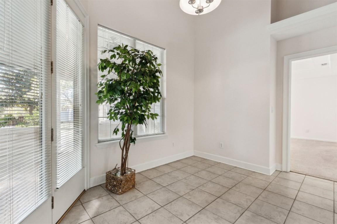 86305 Meadowfield Bluffs Road Yulee, FL 32097 - Photo 22 of 33 an empty room with windows