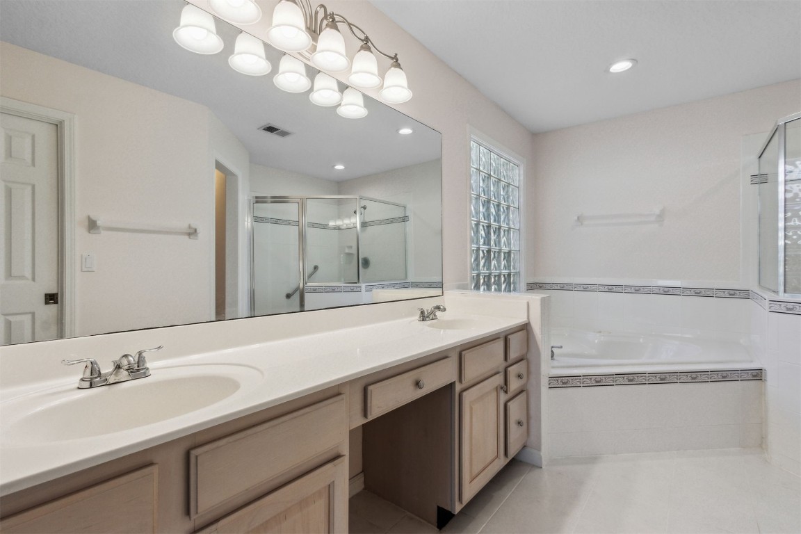 86305 Meadowfield Bluffs Road Yulee, FL 32097 - Photo 26 of 33 a bathroom with a sink double vanity and a mirror