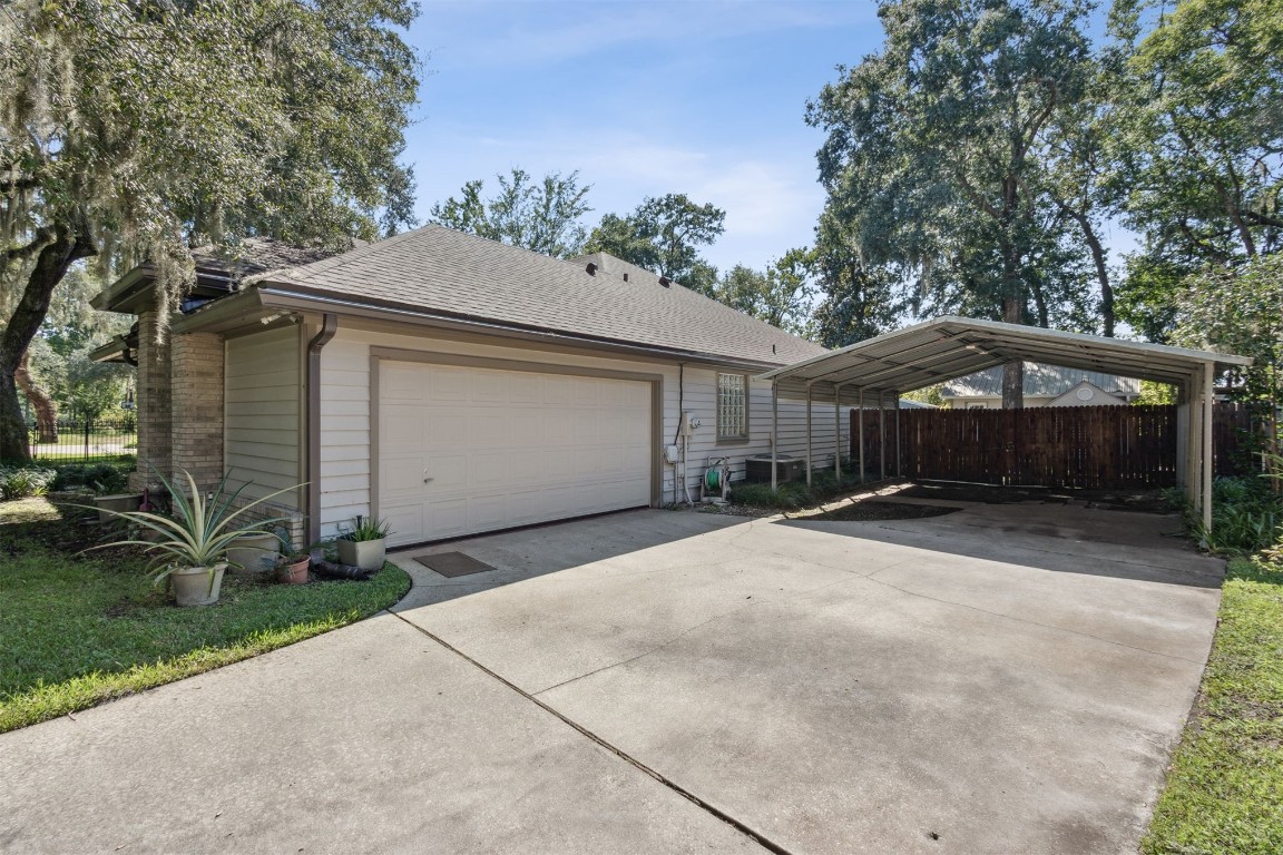 86305 Meadowfield Bluffs Road Yulee, FL 32097 - Photo 30 of 33 a front view of a house with a yard and garage
