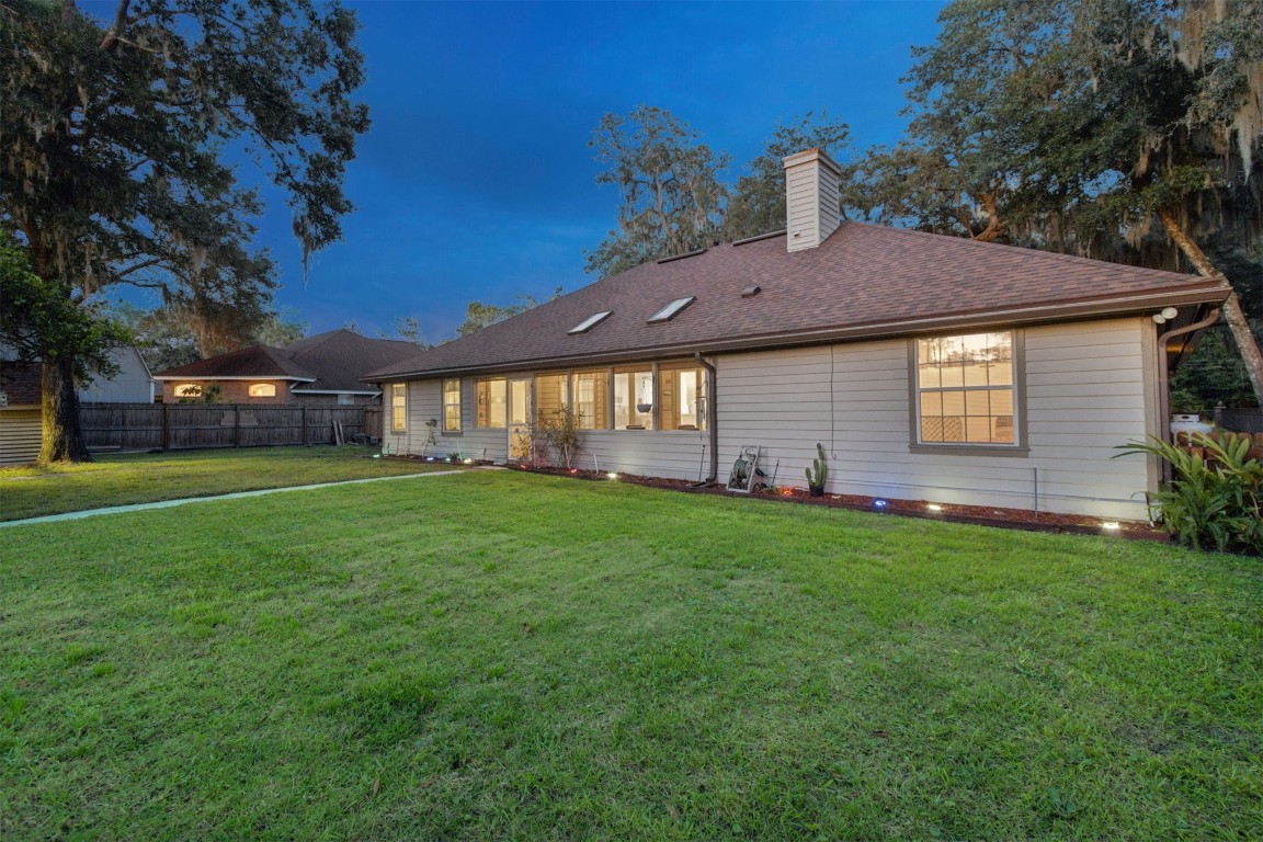 86305 Meadowfield Bluffs Road Yulee, FL 32097 - Photo 33 of 33 a front view of a house with a garden