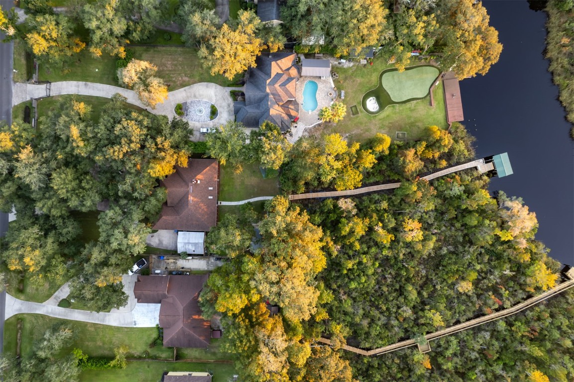 86305 Meadowfield Bluffs Road Yulee, FL 32097 - Photo 4 of 33 an aerial view of residential house with outdoor space and trees all around