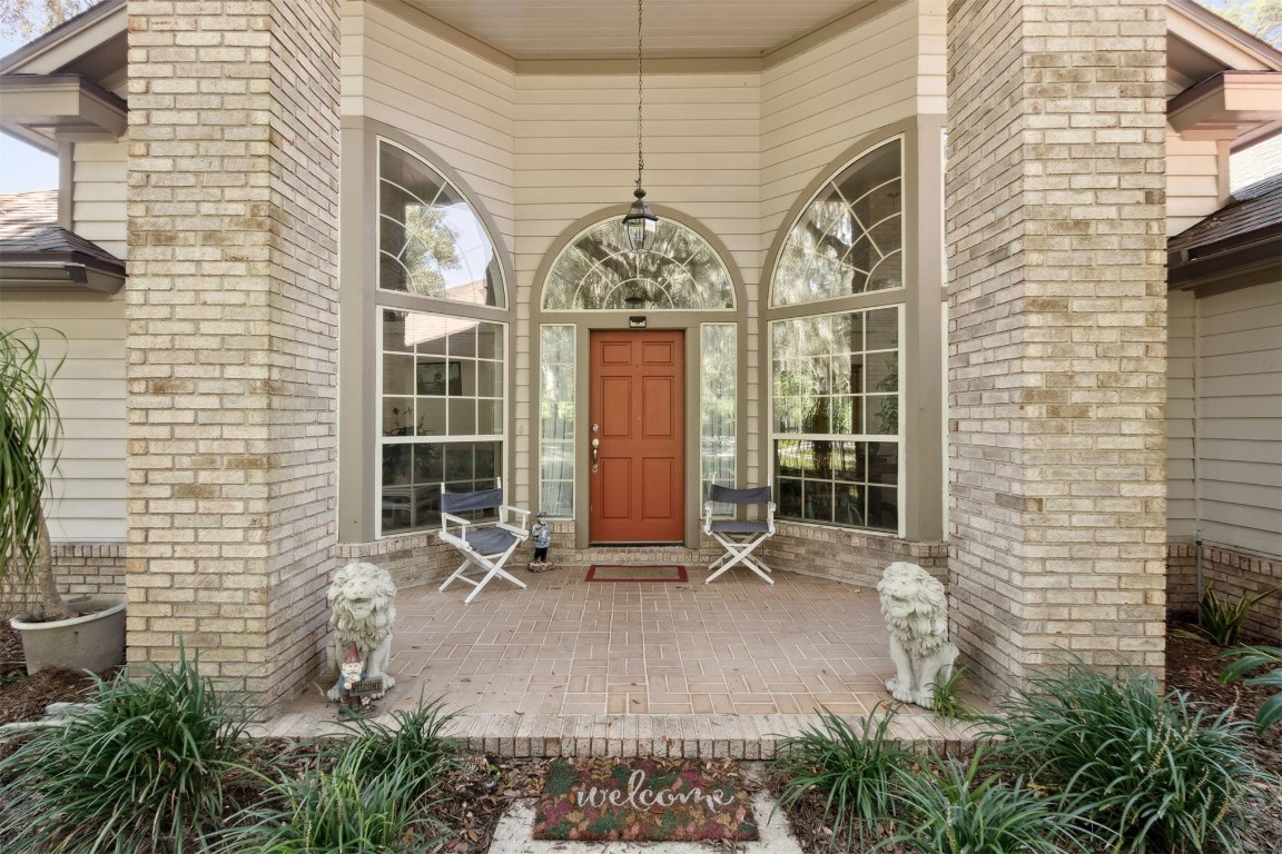 86305 Meadowfield Bluffs Road Yulee, FL 32097 - Photo 8 of 33 a front view of a house with a porch
