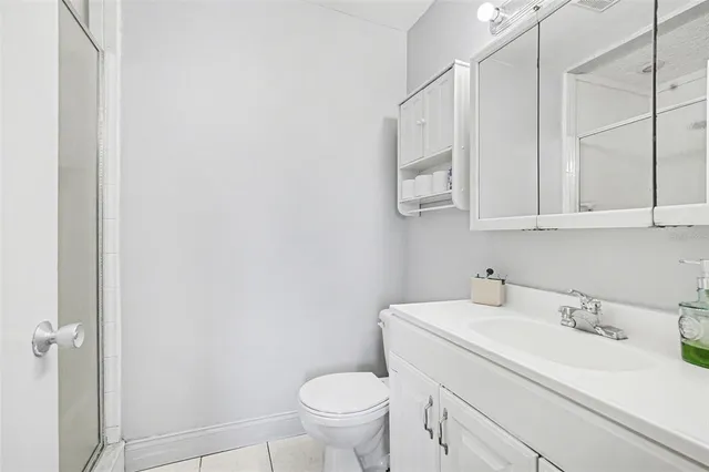 a bathroom with a sink toilet and vanity