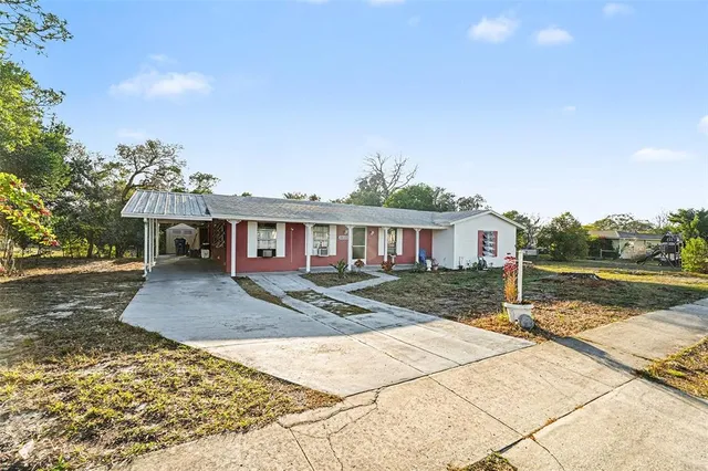 a view of a house with a yard