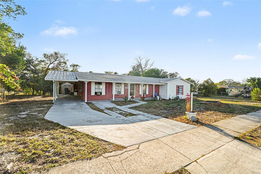 6686 Treehaven Drive Spring Hill, FL 34606 - Photo 3 of 29 a view of a house with a yard