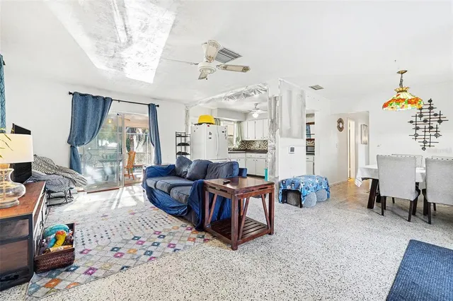 a living room with furniture and a table