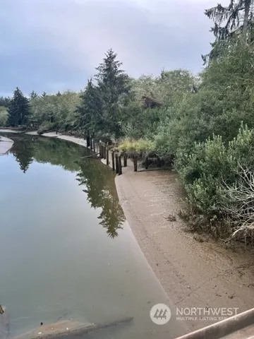 a view of a lake with houses in the back