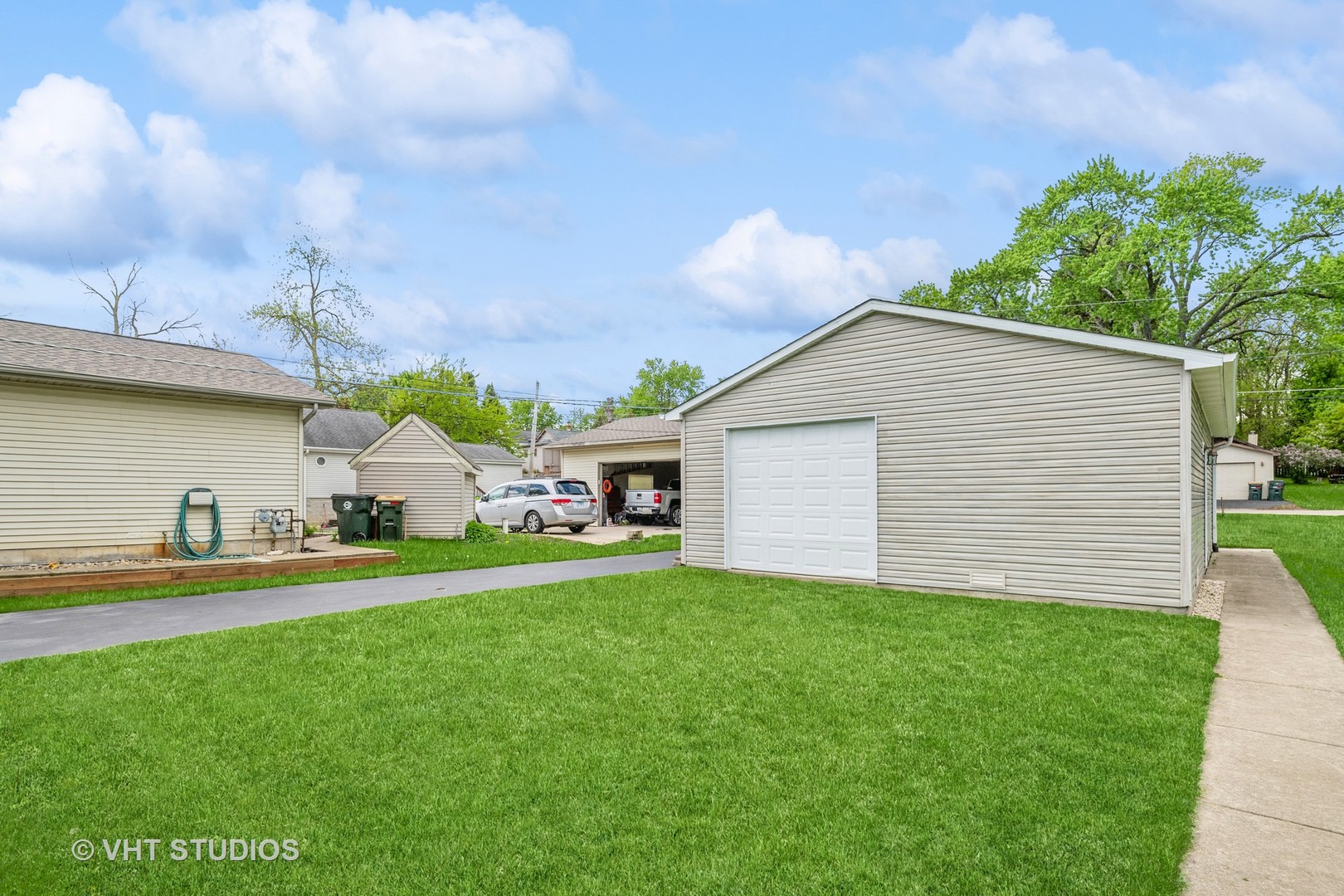36825 North Lake Street Ingleside, IL 60041 - Photo 3 of 14 a front view of a house with a yard and garage