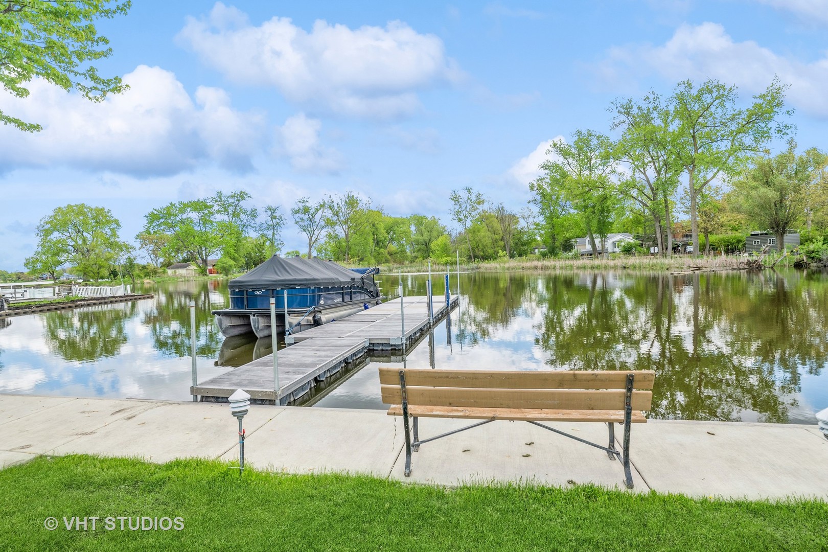 36825 North Lake Street Ingleside, IL 60041 - Photo 10 of 14 a view of a lake with a bench in a lake