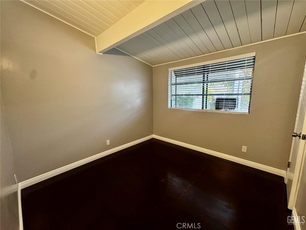 9 Dunlap Street Bakersfield, CA 93309 - Photo 19 of 22 a view of an empty room with wooden floor and a window