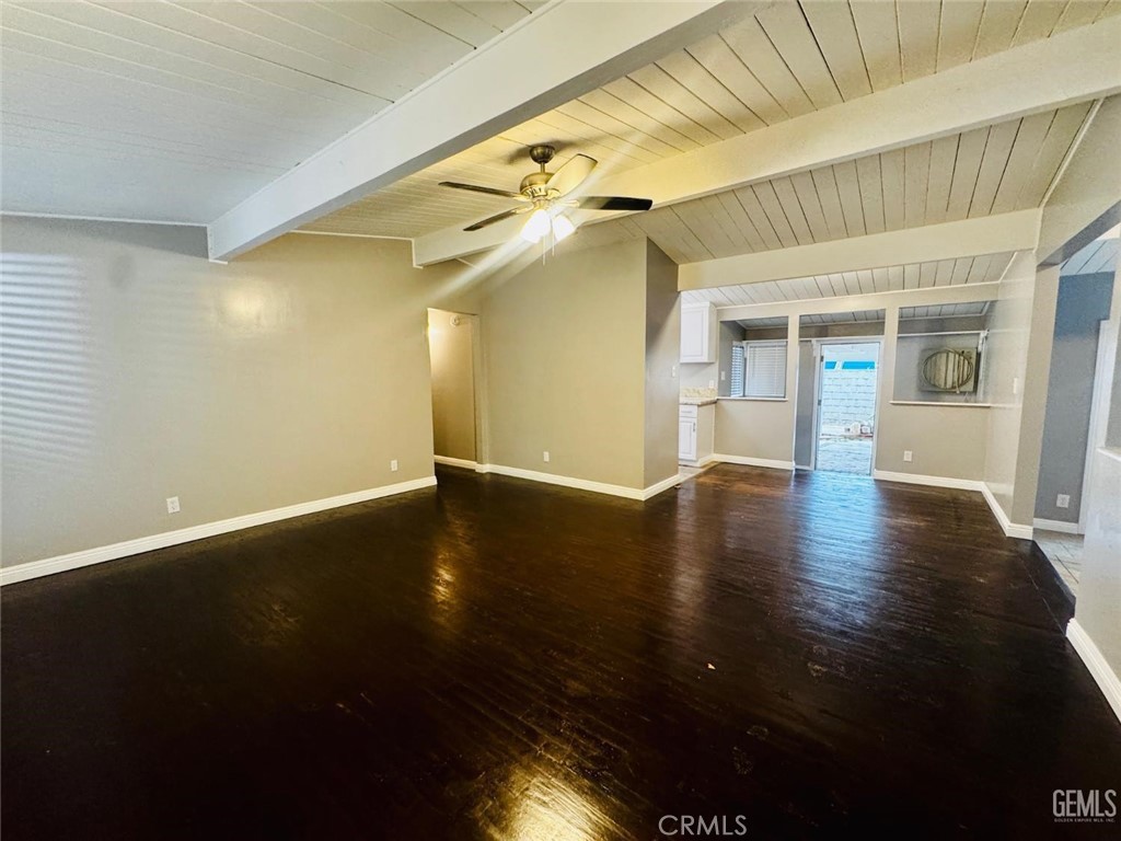 9 Dunlap Street Bakersfield, CA 93309 - Photo 5 of 22 a view of an empty room with wooden floor