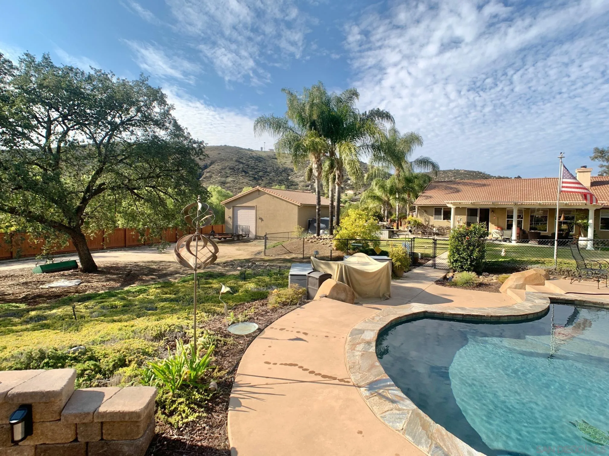 17272 Prairie Mile Road Ramona, CA 92065 - Photo 40 of 51 a backyard of a house with table and chairs