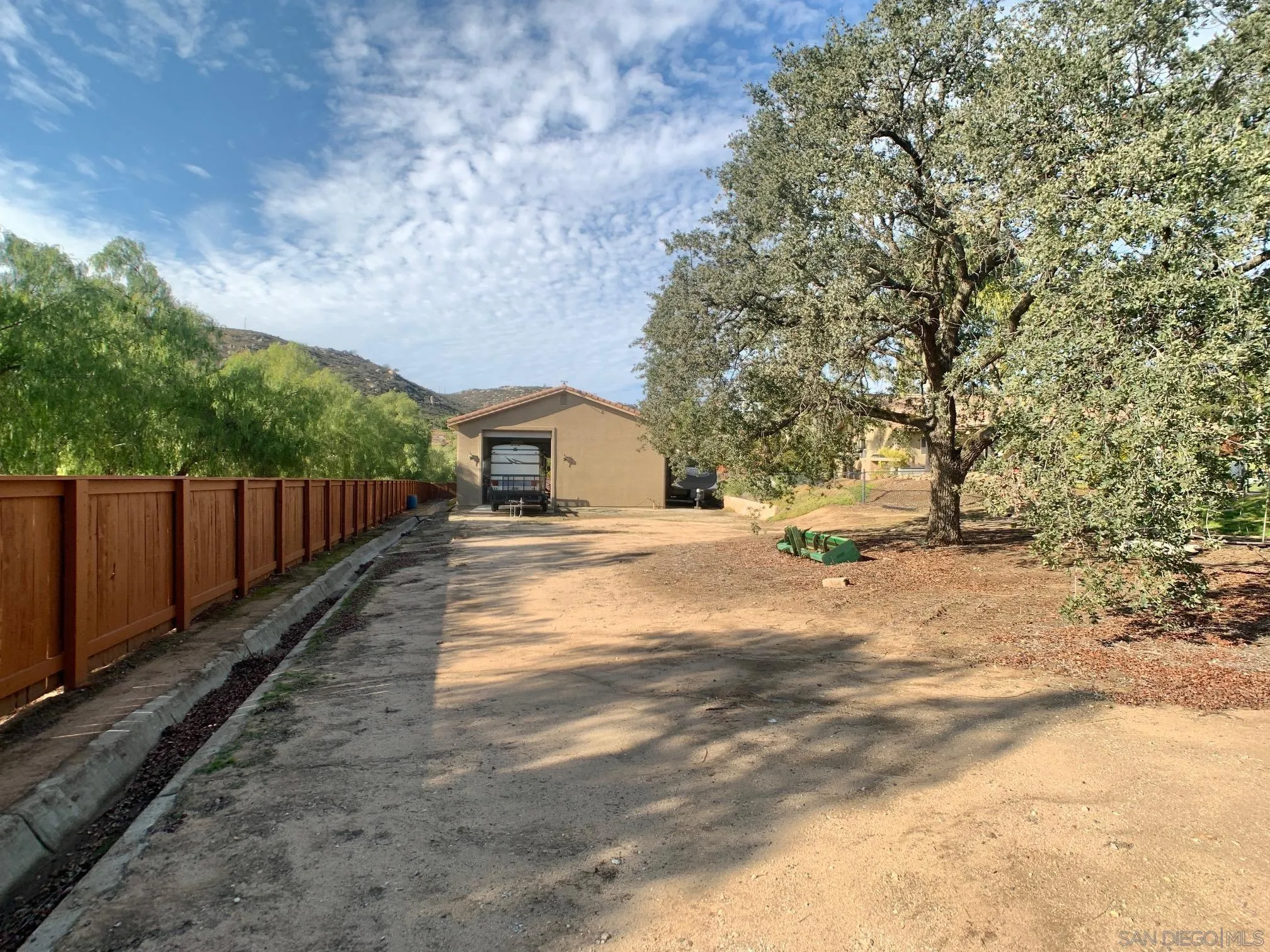17272 Prairie Mile Road Ramona, CA 92065 - Photo 7 of 51 a view of house with backyard and trees