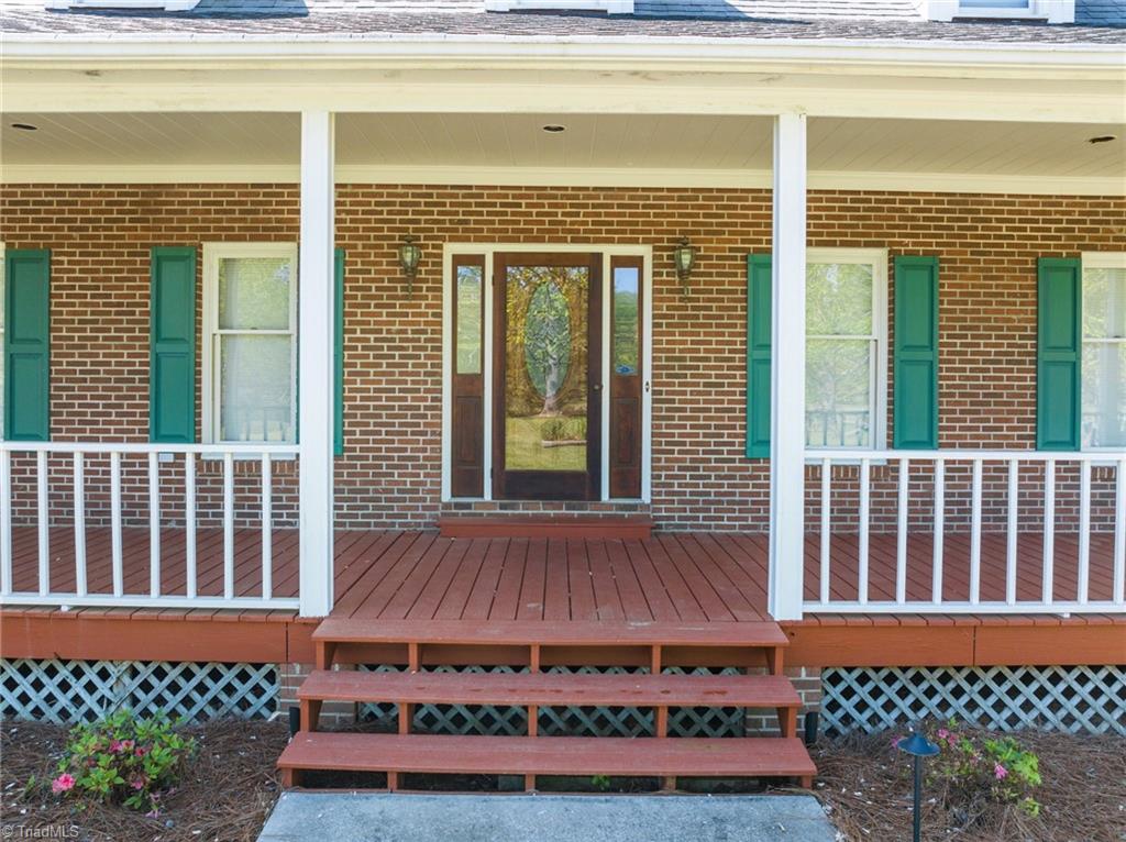 130 Deer Path Summerfield, NC 27358 - Photo 13 of 50 Enter the house through the front covered porch.