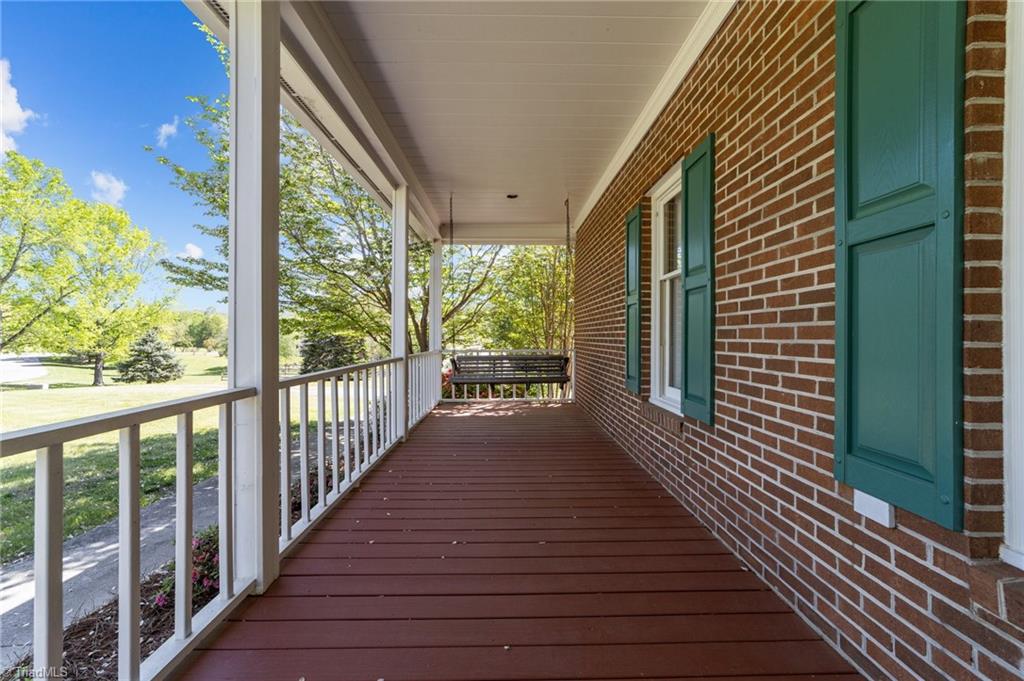 130 Deer Path Summerfield, NC 27358 - Photo 14 of 50 Spacious front porch on the main floor.