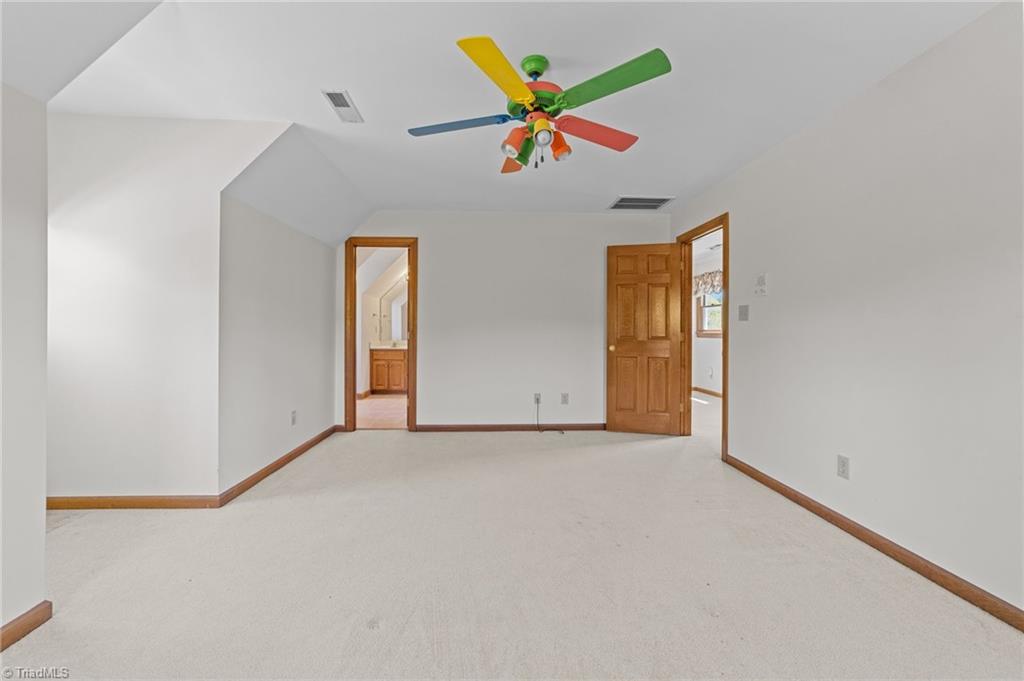 130 Deer Path Summerfield, NC 27358 - Photo 25 of 50 Another angle of the 2nd bedroom with ceiling fan.