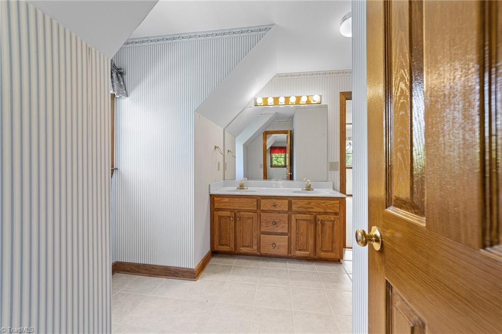 130 Deer Path Summerfield, NC 27358 - Photo 26 of 50 Full bathroom connected to the bedrooms on the second floor.