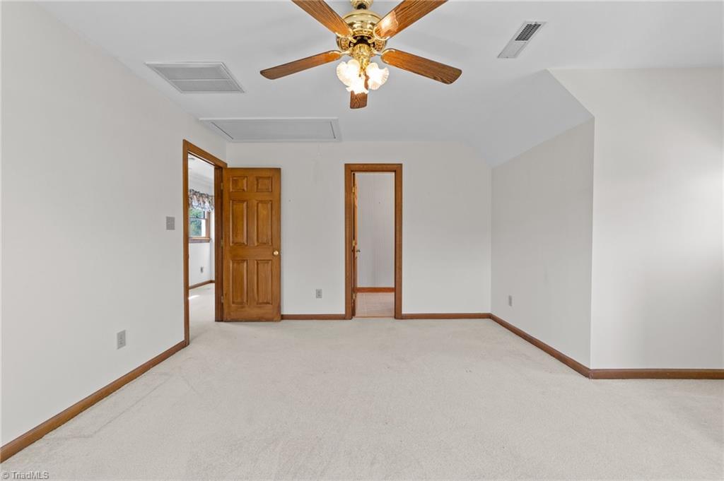 130 Deer Path Summerfield, NC 27358 - Photo 30 of 50 3rd bedroom with ceiling fan.