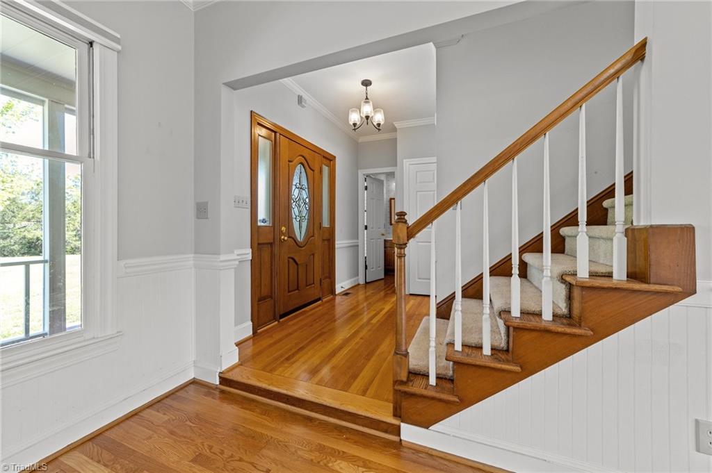 130 Deer Path Summerfield, NC 27358 - Photo 3 of 50 Foyer on the main floor from the living area of the home.