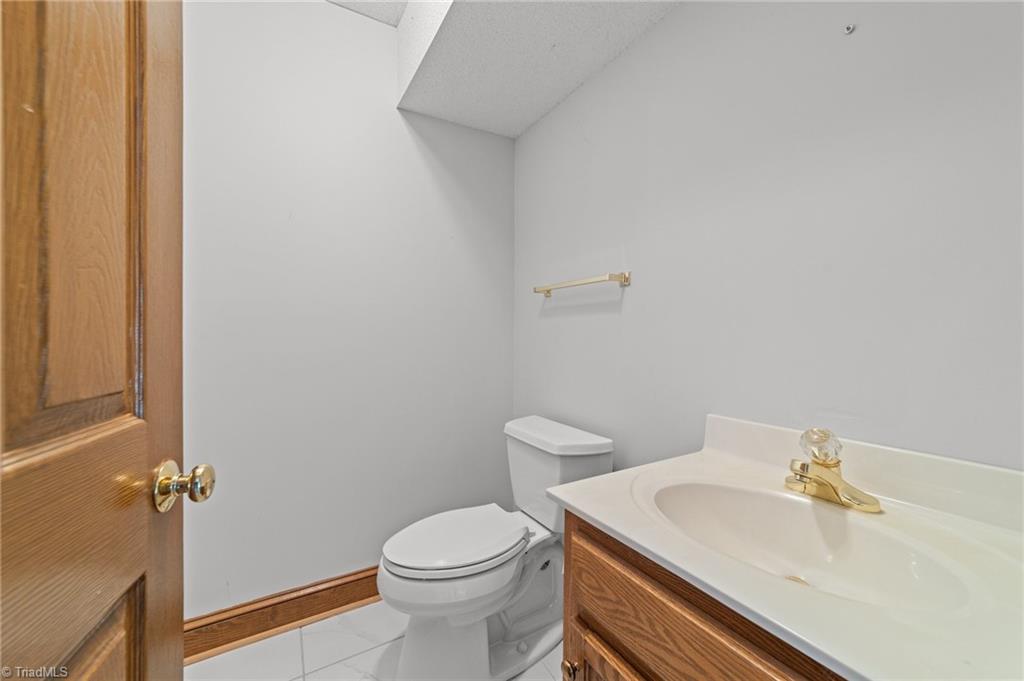 130 Deer Path Summerfield, NC 27358 - Photo 33 of 50 Half bathroom on the basement of the home.