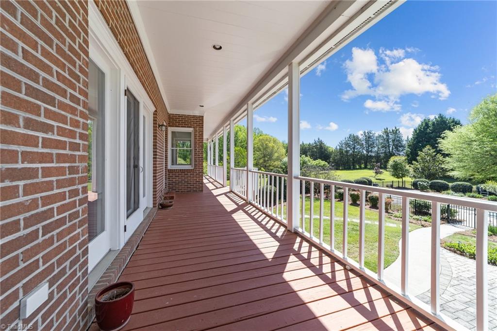 130 Deer Path Summerfield, NC 27358 - Photo 35 of 50 Wrap around deck provides uninterrupted view of your property.