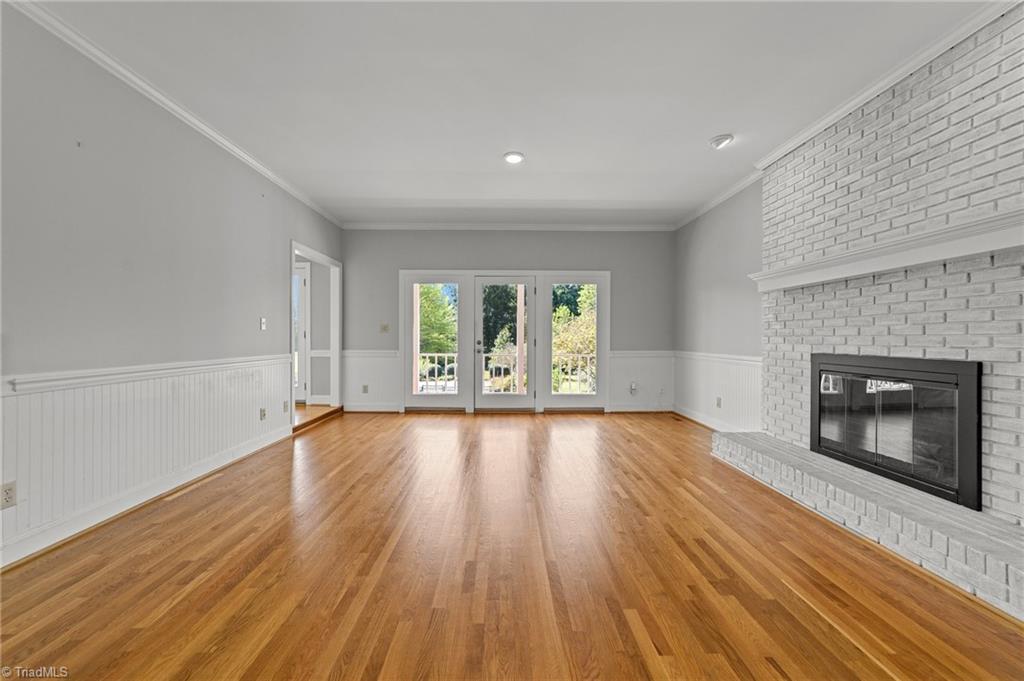 130 Deer Path Summerfield, NC 27358 - Photo 4 of 50 Huge living room with fireplace.