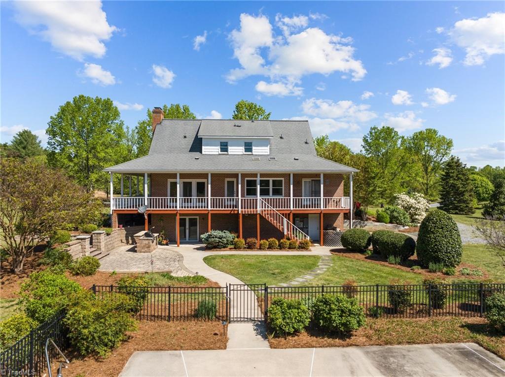 130 Deer Path Summerfield, NC 27358 - Photo 41 of 50 View of the back of the home from the pool.