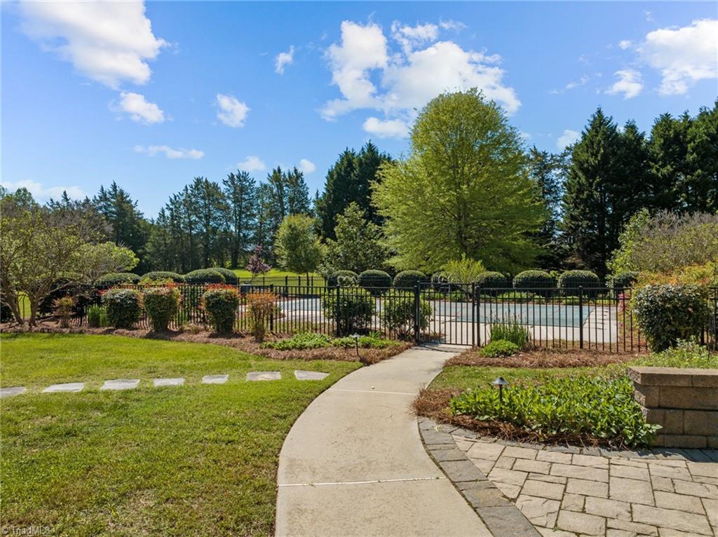 130 Deer Path Summerfield, NC 27358 - Photo 43 of 50 Way to the huge pool in the backyard.