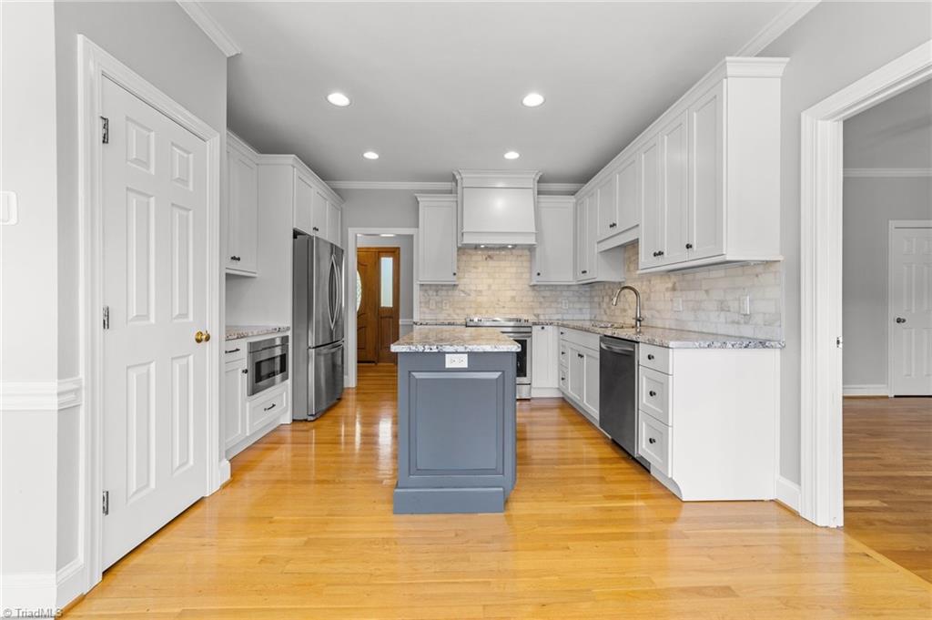 130 Deer Path Summerfield, NC 27358 - Photo 6 of 50 Updated kitchen on the main floor.