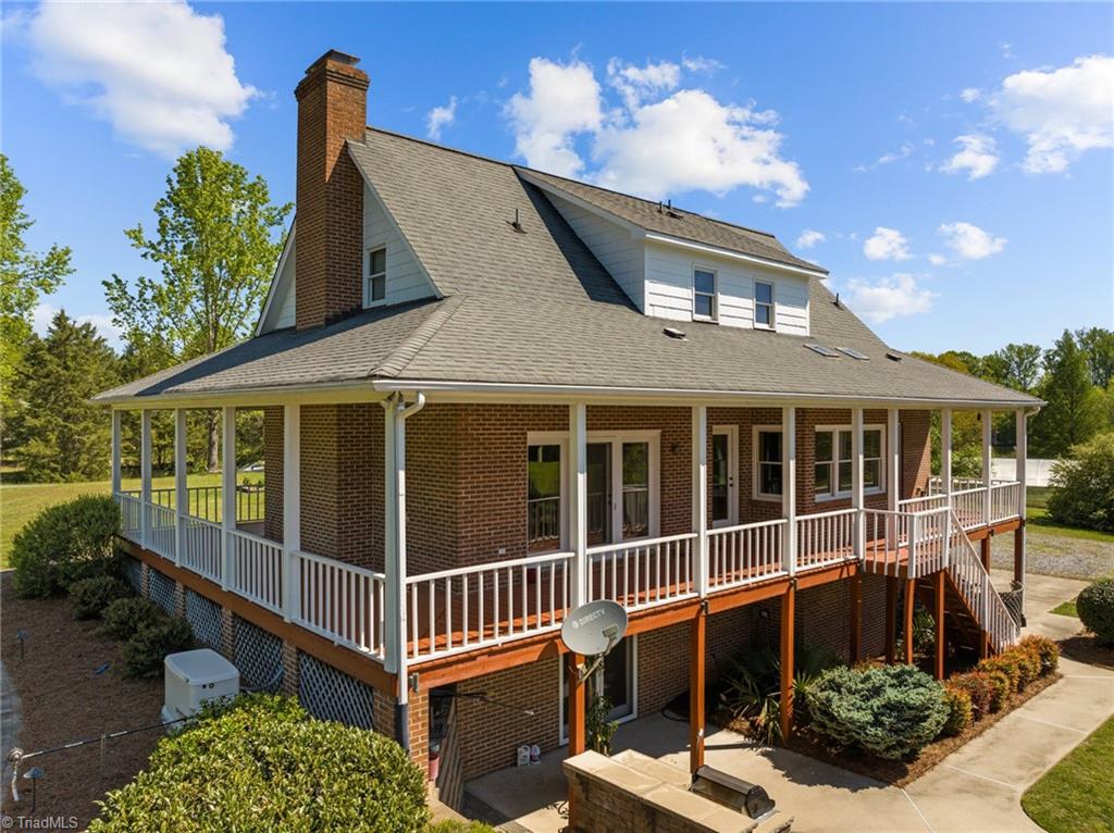 130 Deer Path Summerfield, NC 27358 - Photo 10 of 50 Aerial shot of the wrap around deck.