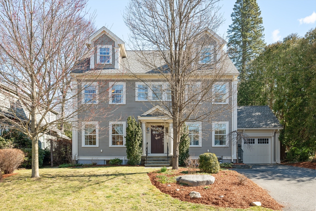 29 Dexter Road Lexington, MA 02420 - Photo 1 of 1 a front view of a house with a yard and large tree