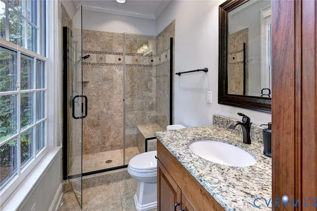 a bedroom with a large bed and a large window