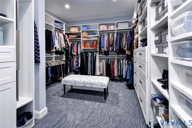 a bathroom with a granite countertop tub a sink and a shower