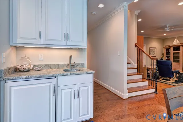 a balcony with chairs and a table