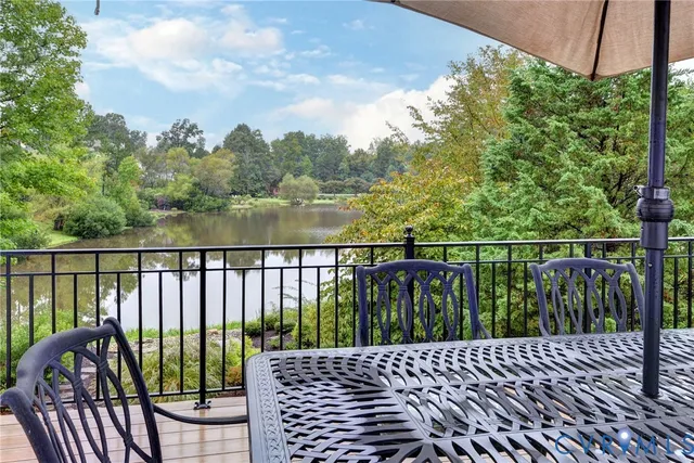 a backyard of a house with a yard and outdoor seating