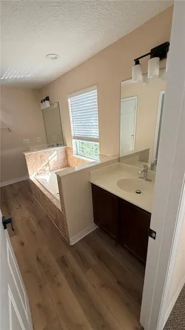 a room with a sink and a mirror