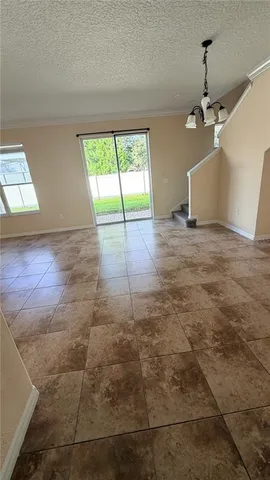 an empty room with windows and entrance